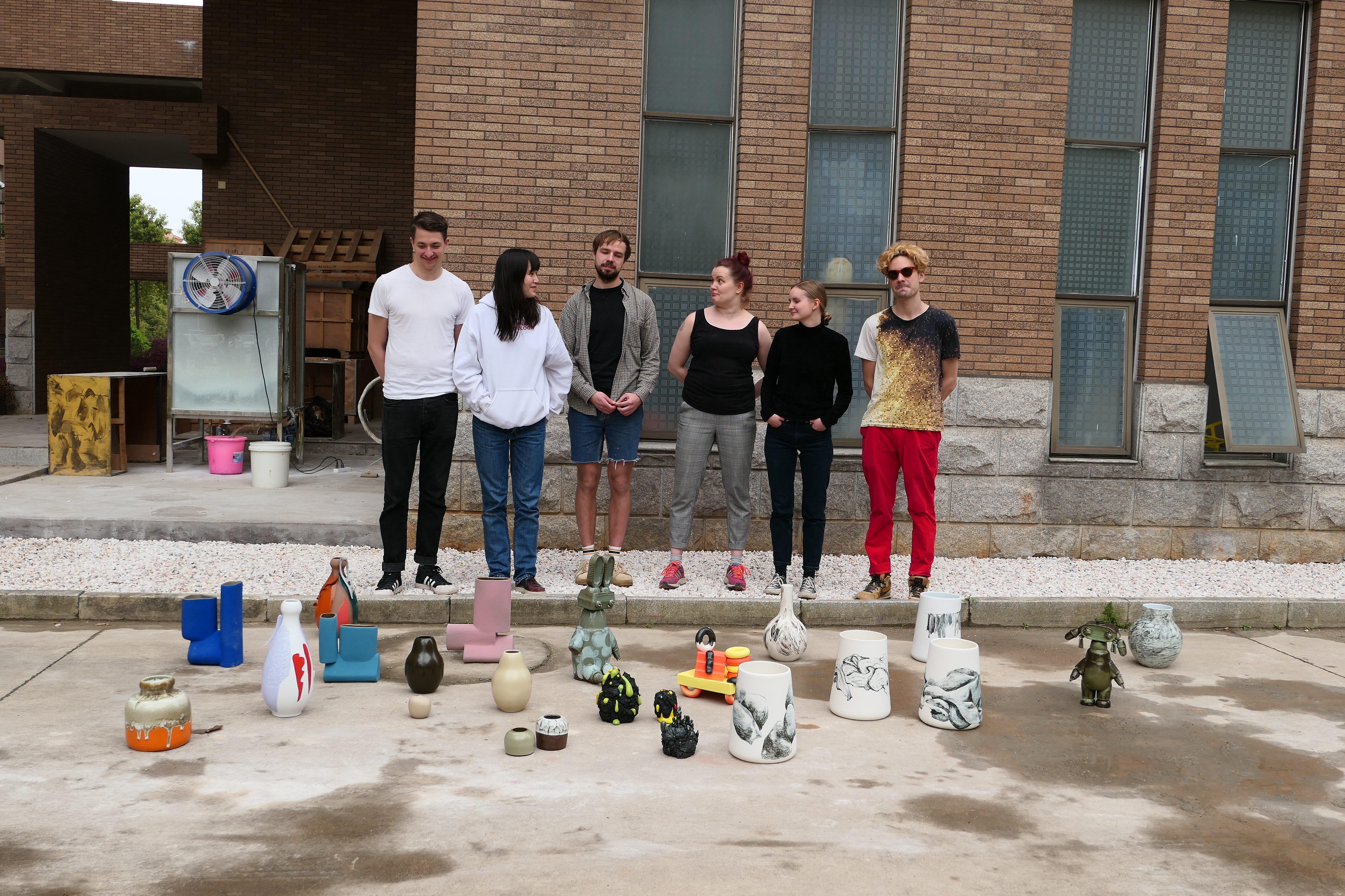 Group of Aalto University students with their finished vases in front of the studio in Jingdezhen, China. Image: Priska Falin, 2018.